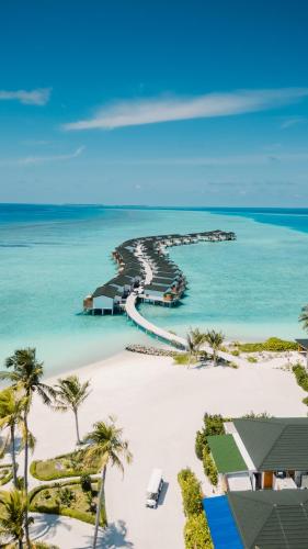 an aerial view of the beach at the excellence punta cana resort at Joy Island Maldives All Inclusive Resort in Male City