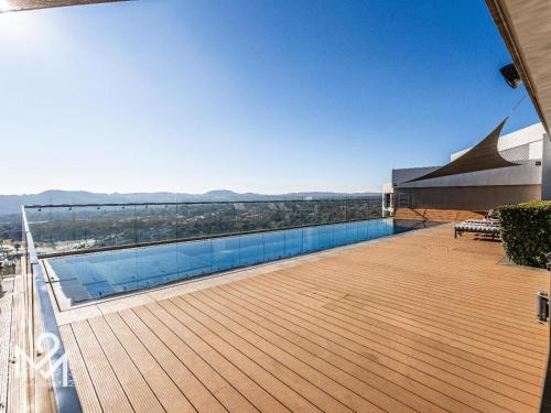 a swimming pool on the roof of a building at Menlyn Maine Luxury Rentals in Pretoria