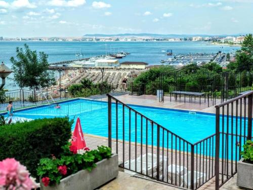 a swimming pool with a view of the water at Ela, Kedar 5 in Sveti Vlas