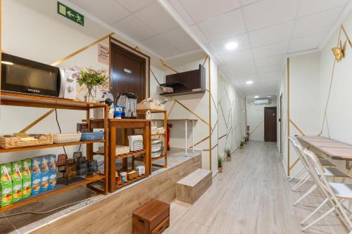 Kuchyň nebo kuchyňský kout v ubytování 7A Hostal