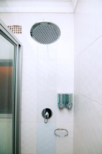 a bathroom with a shower and a sink at Luxe Countryside Convention Center in Livingstone