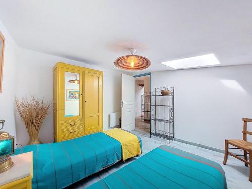 a bedroom with two beds and a table at Holiday Home Petichaud by Interhome in Saint-Sulpice-dʼArnoult