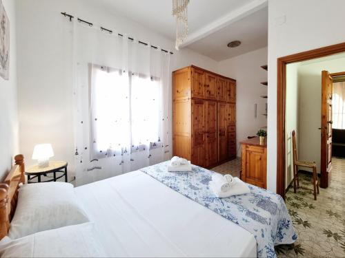 Ένα ή περισσότερα κρεβάτια σε δωμάτιο στο Villa Giusy