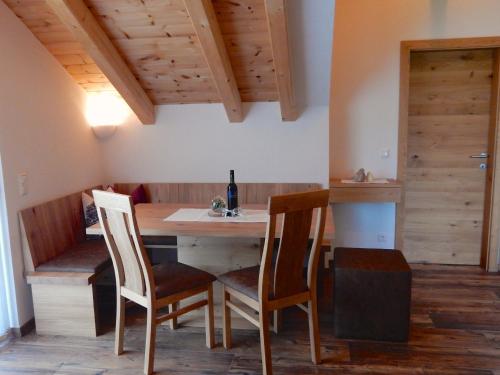 a dining room with a table and two chairs at Ferienwohnung Kirchschlager in Bad Aussee