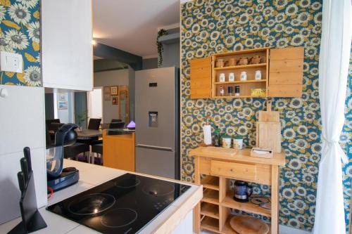 a kitchen with a refrigerator and a counter top at Lux Apartment Duje in Split