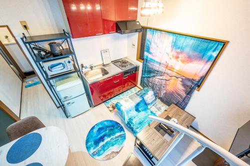 an overhead view of a small kitchen with a sink at Costa Beach, 8min the beach, 4min Enoshima Station, free Wi-Fi in Kamakura