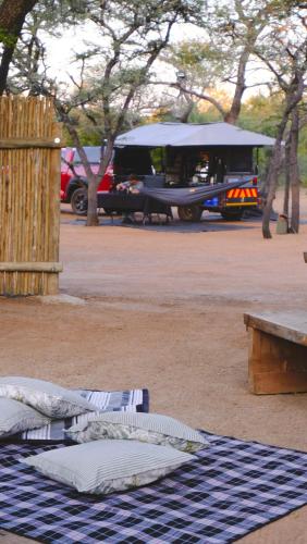 a group of pillows on the ground in a parking lot at Mologa River Lodge in Rust de Winter
