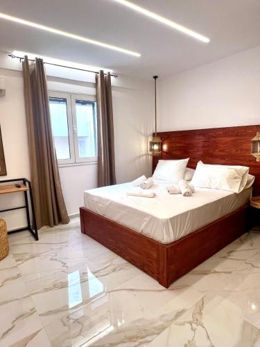 a bedroom with a large bed in a room at Your Stylish Home near Centre in Thérissos