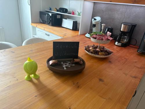a table with a book and a bowl of food on it at Mühlenzauber Hameln in Hessisch Oldendorf