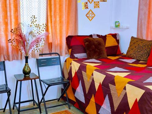 Ένα ή περισσότερα κρεβάτια σε δωμάτιο στο NeelMohar Bellevue 8