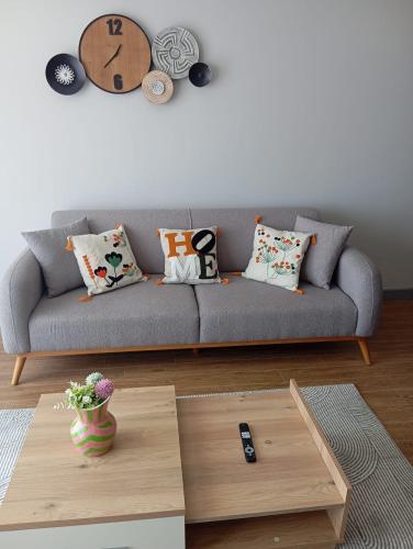 a living room with a couch and a coffee table at Exclusive Residence Famagusta in Famagusta