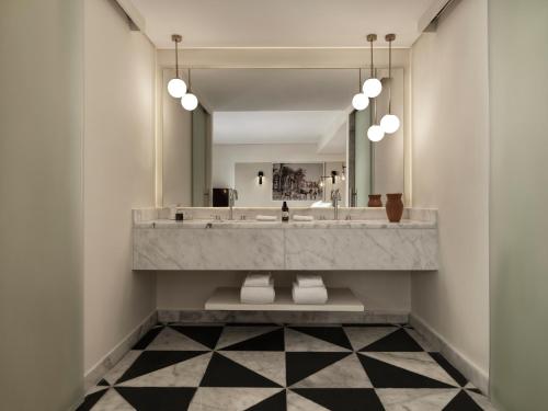 a bathroom with a large sink and a mirror at The Chedi El Gouna in Hurghada