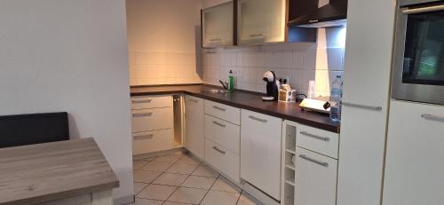 Kuchyň nebo kuchyňský kout v ubytování Privat Appartement R D