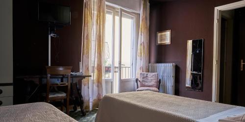 Postel nebo postele na pokoji v ubytování Bridge Hotel