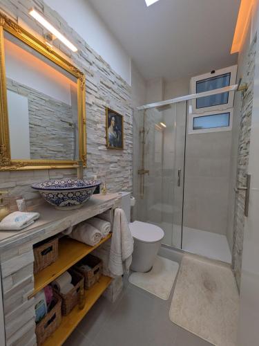 a bathroom with a shower and a toilet and a sink at PRINCESS FLOWER - Sea, View, Parking, Center in Funchal