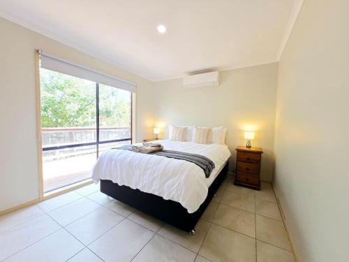 Ένα ή περισσότερα κρεβάτια σε δωμάτιο στο Sweet Home at Carrum Downs