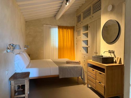 Ein Bett oder Betten in einem Zimmer der Unterkunft Podere Castellare
