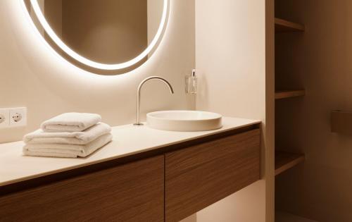 a bathroom with a sink and a mirror at Haven Mountain Retreat in Sankt Johann im Pongau