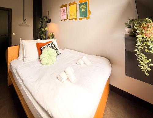 Ένα ή περισσότερα κρεβάτια σε δωμάτιο στο De Pijp Boutique Hotel