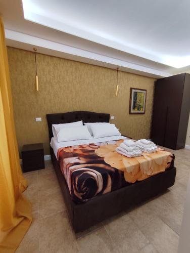 a bedroom with a large bed in a room at La Pietra 1911 in Ercolano