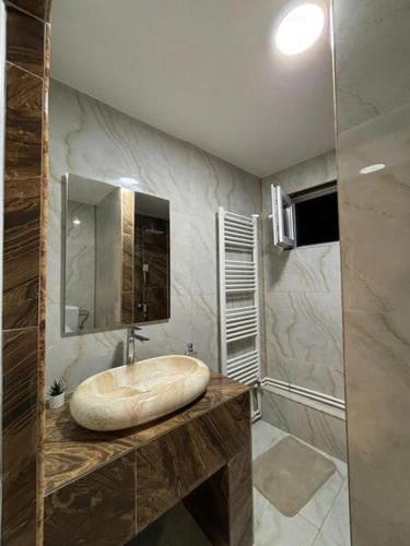 a bathroom with a sink and a mirror at Casa la Cristi in Figa