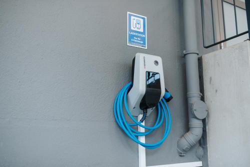a phone is attached to the side of a wall at Coffee Fellows Hotel Trier in Trier