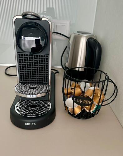 a toaster and a basket of bread on a counter at Studio Horizon Dorigny in Lausanne