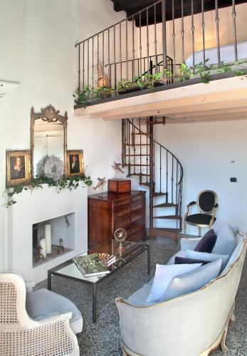 a living room with a couch and a table at Arnaboldi Palace in Pavia