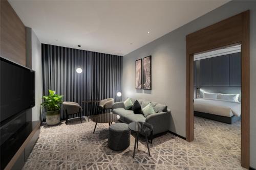 Postel nebo postele na pokoji v ubytování Radisson Blu Hotel, Riyadh Al Sahafa