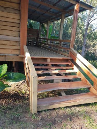 a porch of a cabin with wooden stairs at Sielerus in The Crags