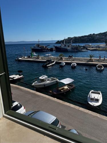 a view of a marina with boats in the water at Seafront Studio Porat in Sumartin