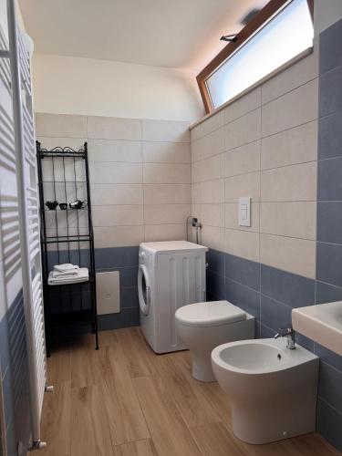 a bathroom with a toilet and a sink at Da Francesca in Foria