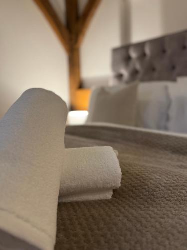a roll of toilet paper sitting on top of a table at The Barn Heathfield in Heathfield