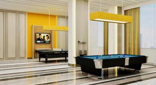 a lobby with a pool table and a piano at Country Inn & Suites By Migrolino in Lucknow