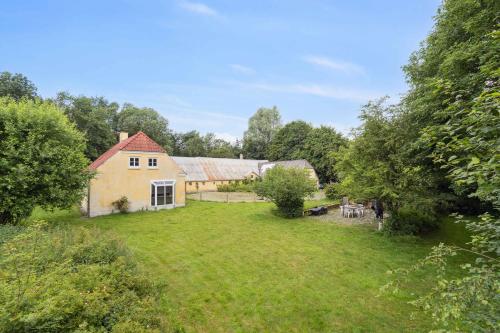 an aerial view of a farmhouse with a yard at Bright Holiday Home With Garden And Togetherness in Varde