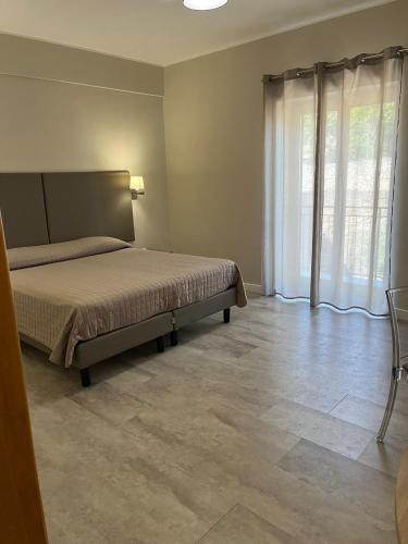Ένα ή περισσότερα κρεβάτια σε δωμάτιο στο Il Gabbiano