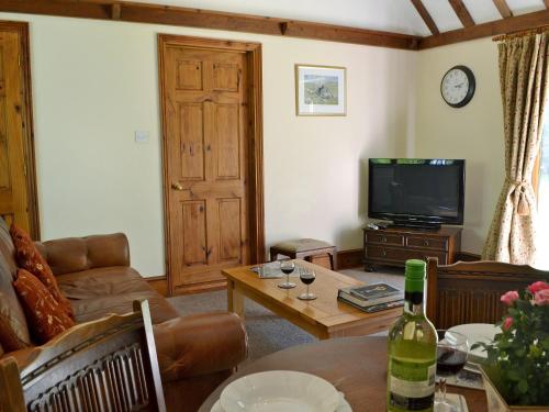 TV a/nebo společenská místnost v ubytování Ivy Cottage