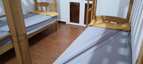 a bunk bed in a room with two chairs at Venez découvrir l'un des meilleurs coucher de soleil 