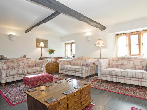 a living room with couches and a coffee table at The Boot in Dulverton