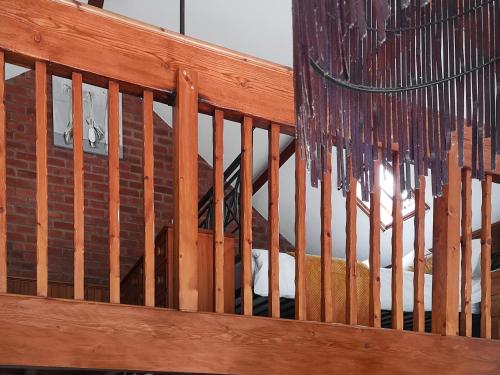 a wooden railing with icicles hanging from it at Elm Barn Lodge in Freethorpe