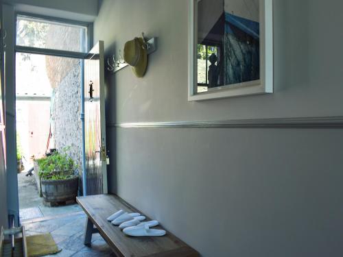 a room with a bench and a mirror on the wall at St Andrews in Pittenweem