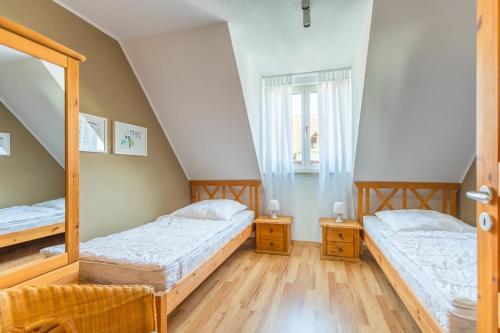 Ένα ή περισσότερα κρεβάτια σε δωμάτιο στο Haus Breeger Anker - Strandnahes Haus in Breege