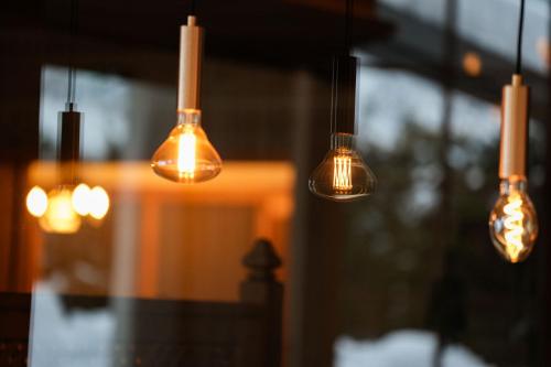 a group of lights hanging in a room at Hotel Elisabeth, 4 Sterne Superior in Kirchberg in Tirol