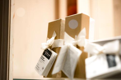 a group of boxes with tags on them at Hotel Elisabeth, 4 Sterne Superior in Kirchberg in Tirol
