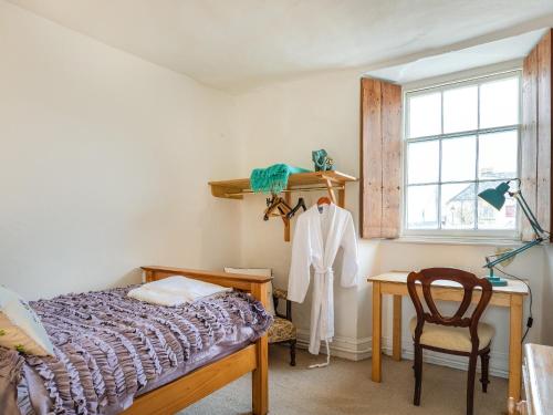 Postel nebo postele na pokoji v ubytování Sheepwash Square House
