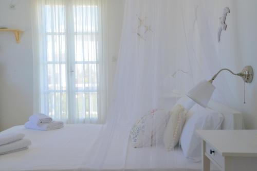 Katil atau katil-katil dalam bilik di Heliotropio Studios & Apartments