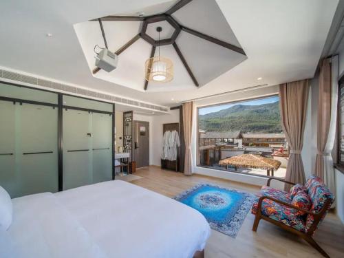 Postel nebo postele na pokoji v ubytování Dawnscape Courtyard 辰曦别苑