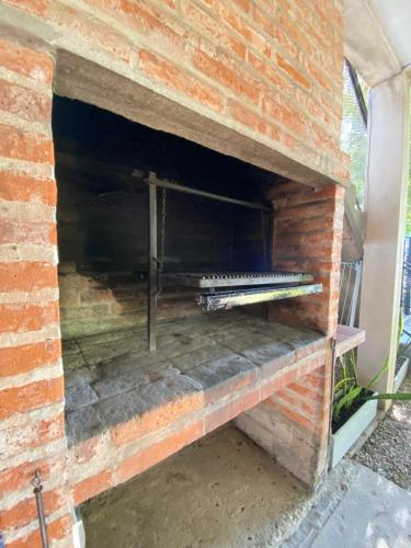 a brick wall with some tools on it at TOLHUIN COLON in Colón