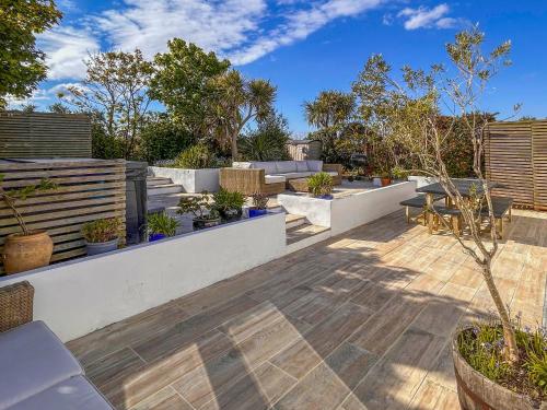a patio with a bunch of potted plants at Villa Calafia - Uk38491 in Porthtowan