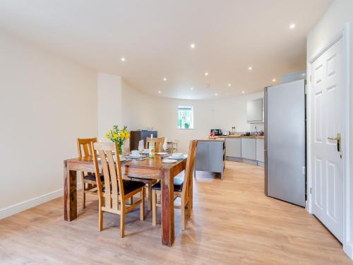 a kitchen and dining room with a table and chairs at The Oast - Uk43087 in Preston